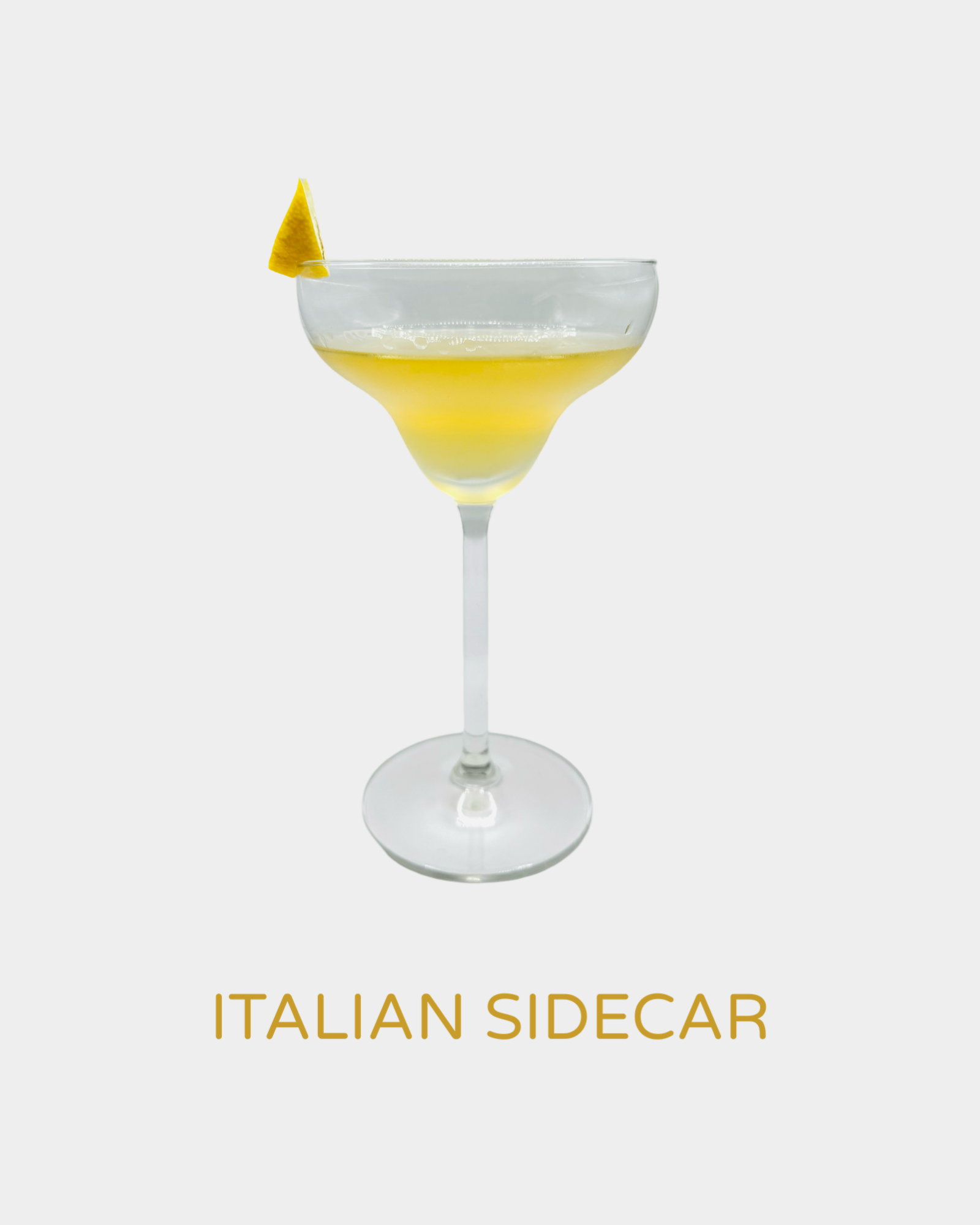 Italian Sidecar cocktail in a coupe glass with a golden hue, garnished with a small lemon wedge. A sophisticated blend of handcrafted organic limoncello from Iannetelli Liqueurs, inspired by the classic Sidecar cocktail