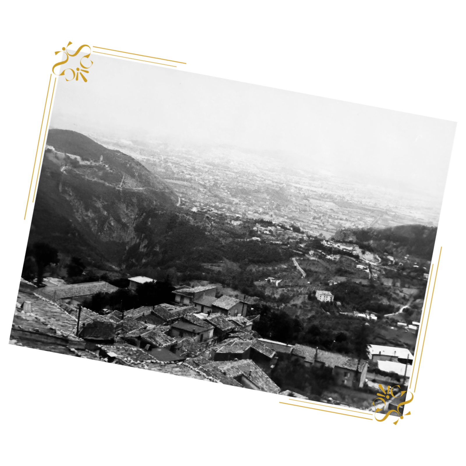 Black and white landscape photo of Castello del Matese, Italy, overlooking the mountainous countryside and village rooftops